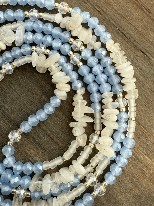 Blue and white waist beads with faceted crystals, frosted glass, and natural moonstone, handmade by Sia Body Beads.