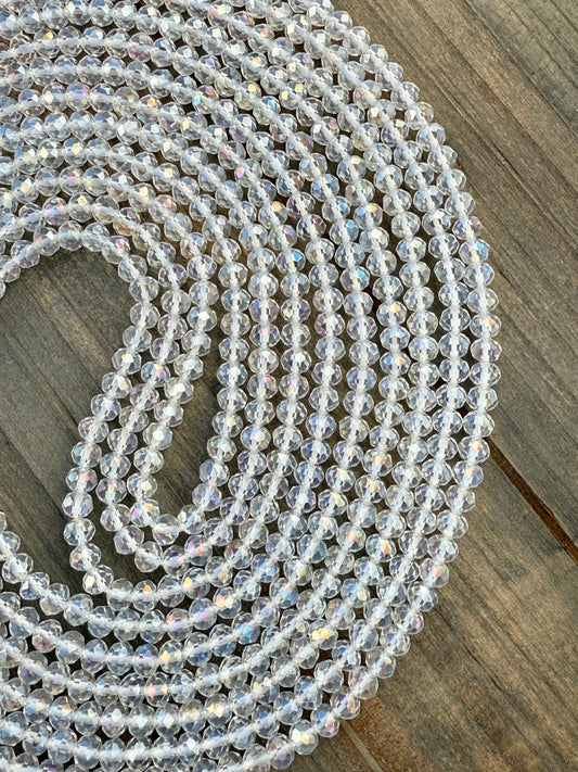 Iridescent clear crystal waist beads with faceted shine, handcrafted by Sia Body Beads for elegant body jewelry.