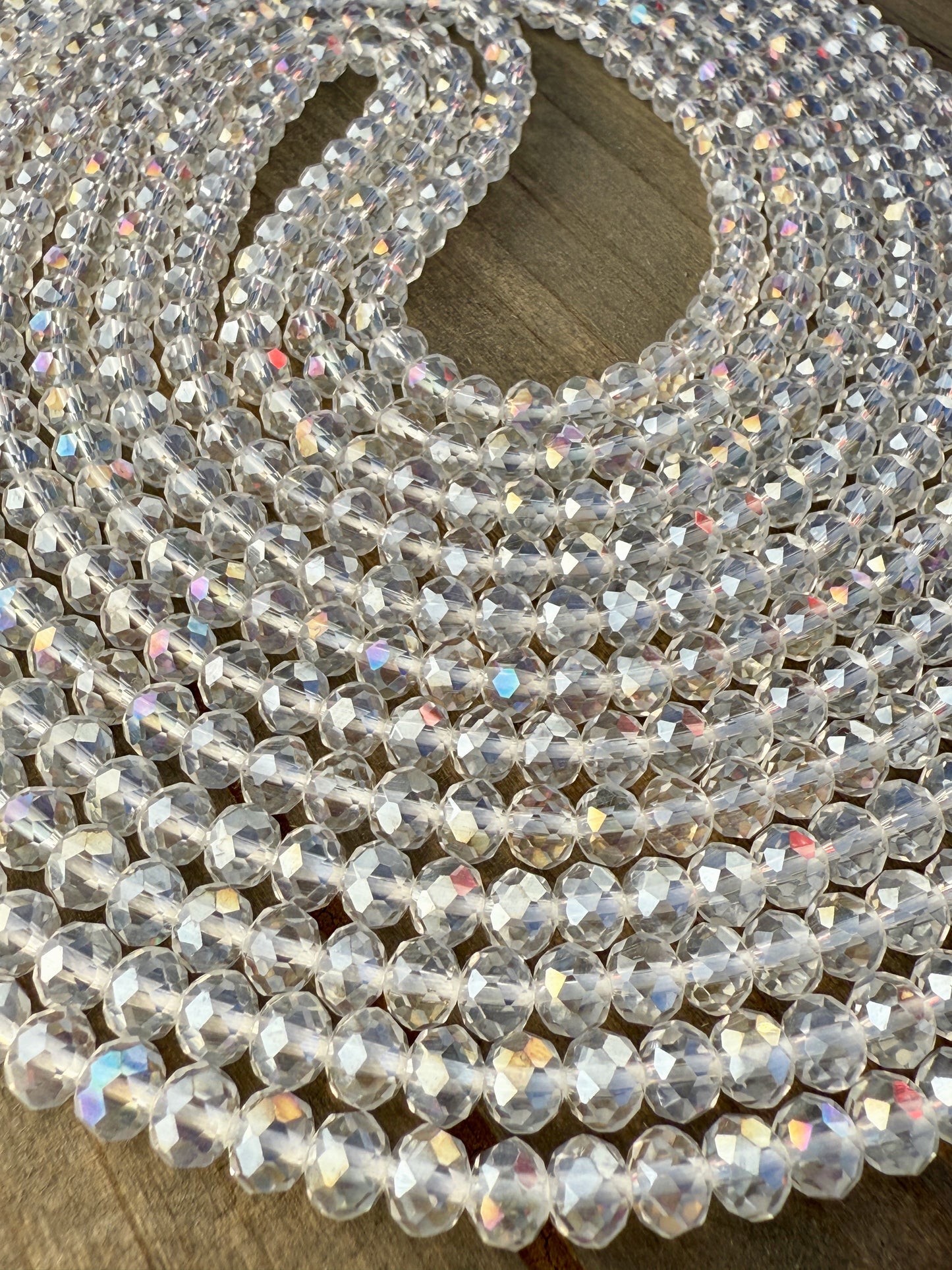 Iridescent clear crystal waist beads with faceted shine, handcrafted by Sia Body Beads for elegant body jewelry.