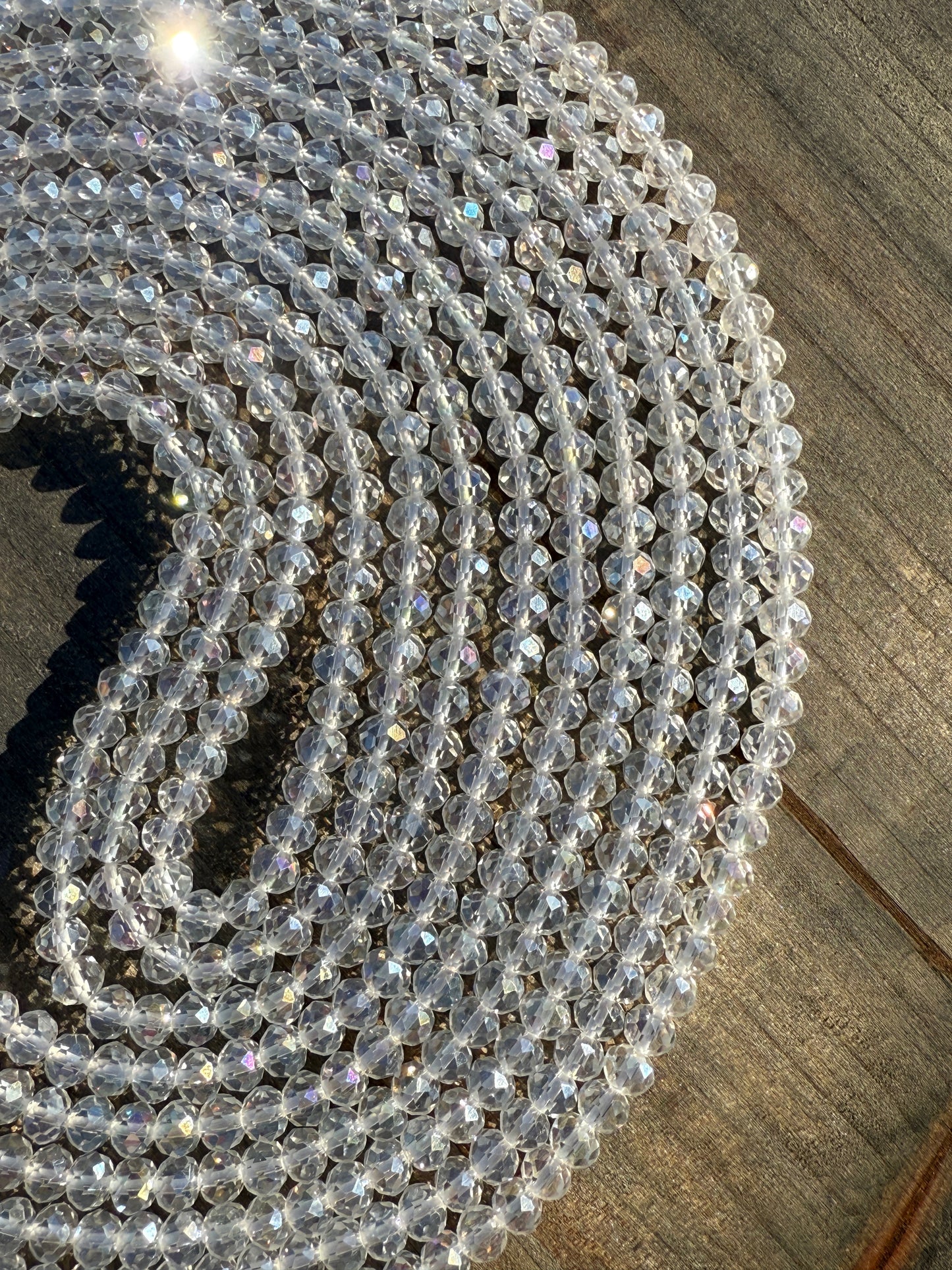Iridescent clear crystal waist beads with faceted shine, handcrafted by Sia Body Beads for elegant body jewelry.