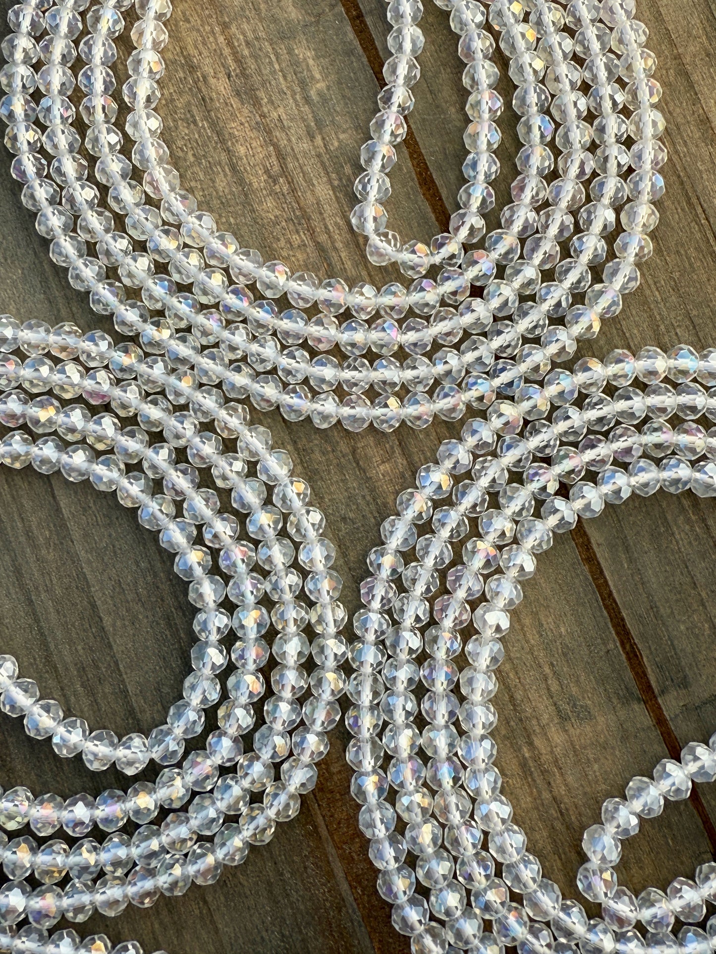 Iridescent clear crystal waist beads with faceted shine, handcrafted by Sia Body Beads for elegant body jewelry.