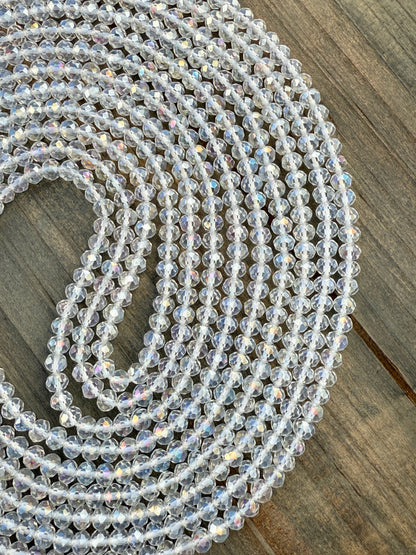 Iridescent clear crystal waist beads with faceted shine, handcrafted by Sia Body Beads for elegant body jewelry.