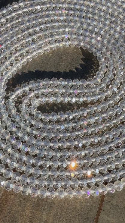 Iridescent clear crystal waist beads with faceted shine, handcrafted by Sia Body Beads for elegant body jewelry.